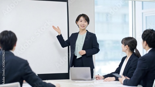 Professional Businesswoman Leading a Meeting with Confident Presentation Skills