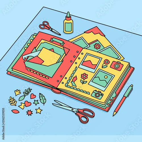 Colorful scrapbook with craft tools on a blue table