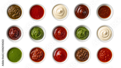 Tableau sur toile Assortment of colorful dipping sauces and condiments in small white bowls