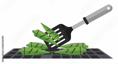 Spatula lifts grilled okra from a barbecue grill grate