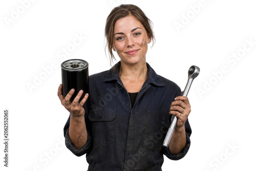 Beautiful Female Auto Mechanic Holding Car Oil Filter and Socket Wrench