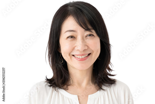 Portrait of a Happy Mature Japanese Woman Smiling Isolated on White