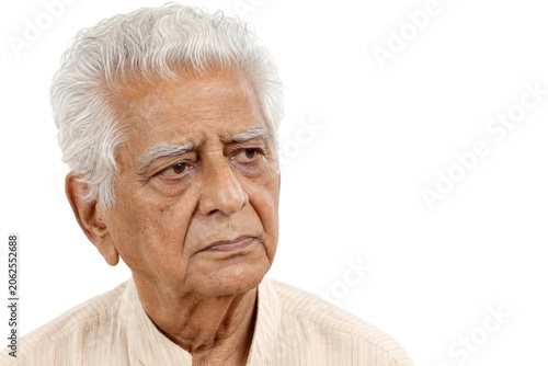Portrait of a Thoughtful Senior Indian Man with White Hair on White Background