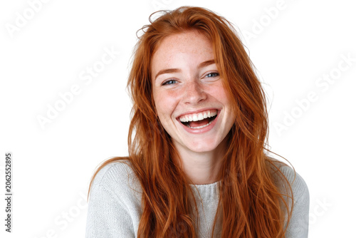 Portrait of a Beautiful Young Redhead Woman Laughing Isolated on White Background