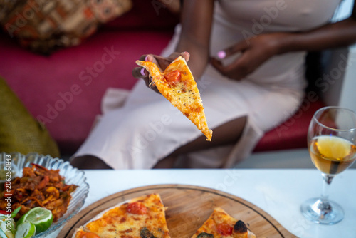 Pizza restaurant cafe model food lifestyle showcasing gourmet pizza dining modern cafe atmosphere and relaxed hospitality experience in Tanzania