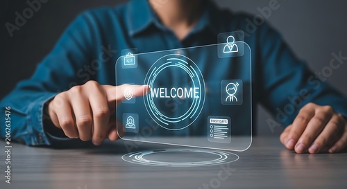 Man Interacting with Futuristic Welcome Screen on Transparent Device.