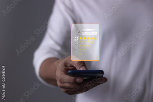 Customer Satisfaction, Young Man hand holding Smart Phone with five star to review and give 5 stars with very good results in service, Good review 5 star rating choice feedback