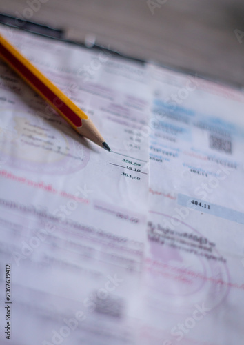 Electricity bill with expense records showing household costs income planning and financial balance.