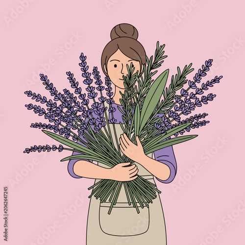 Woman holding a large bouquet of fresh lavender flowers.