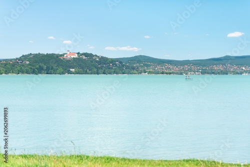 Hungary, Lake Balaton, Benedictine monastery on a hill in Tihany, view from the other shore of Lake Balaton on a sunny summer day.