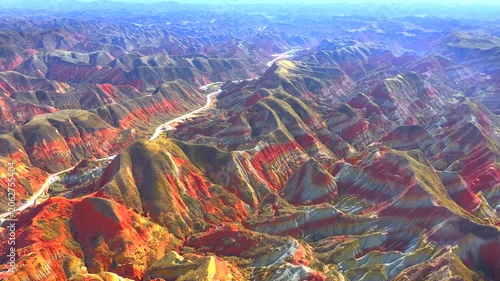 Aerial view, Cinematic drone, Zhangye Danxia, Lanzhou Danxia, Rainbow mountains, Colorful rock formations, Layered stratigraphy, Desert landscape, Canyon texture, Erosion patterns, Geological wonder,