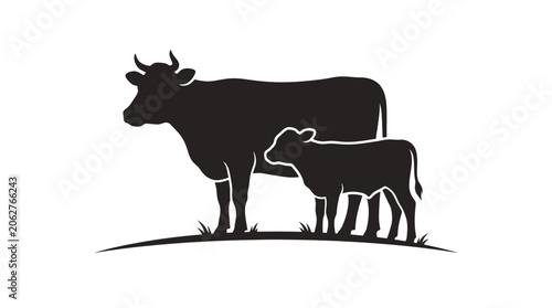Tableau sur toile Cow and calf silhouette standing in a grassy field