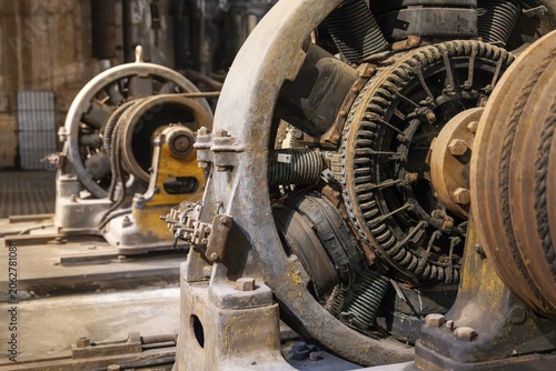 Old, rusted generator with exposed copper windings and stator coils in a disused industrial plant, Fábrica Anglo del Uruguay, Fray Bentos, Río Negro, Uruguay