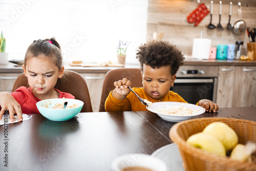 Slika na platnu Family breakfast brings joy to cheerful kids at home