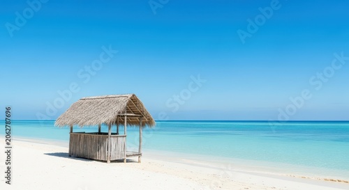 Tropical scene featuring small thatched roof huts resting on white sand near the calm, clear ocean water under a bright blue sky, Beach, peaceful, holiday