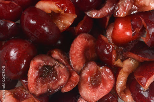 Tableau sur toile A close up shot of juicy fresh sweet cherries cut in half with the pits removed