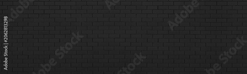 Black brick wall wide panoramic texture. Dark rough exterior brickwork backdrop panorama. Abstract gloomy grunge large long wallpaper background