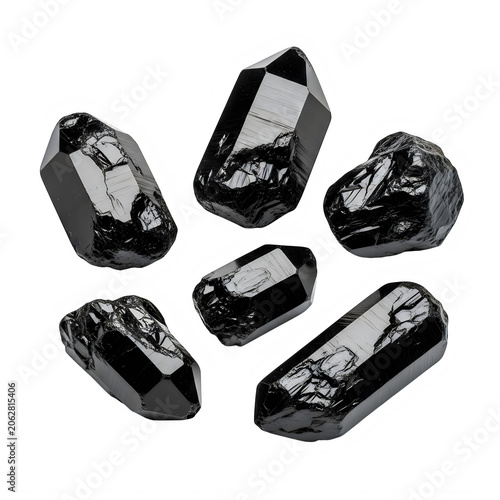 Assorted black gemstones and crystals on neutral background