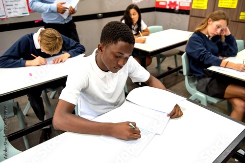 Fotografie Students focused during classroom exam.