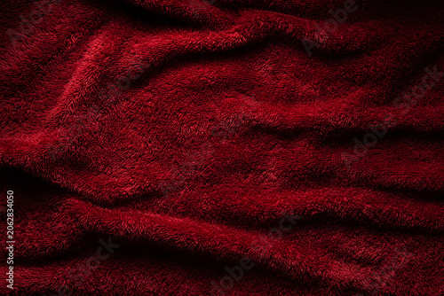 Elegant crimson plush fabric background folds