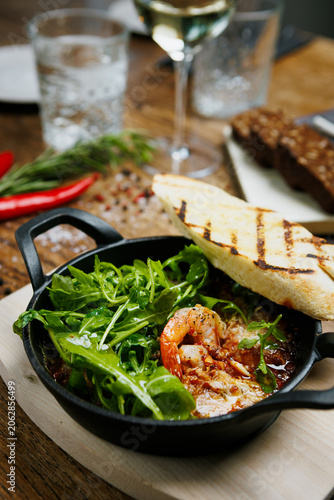 Rustic seafood starter with grilled bread and fresh herbs