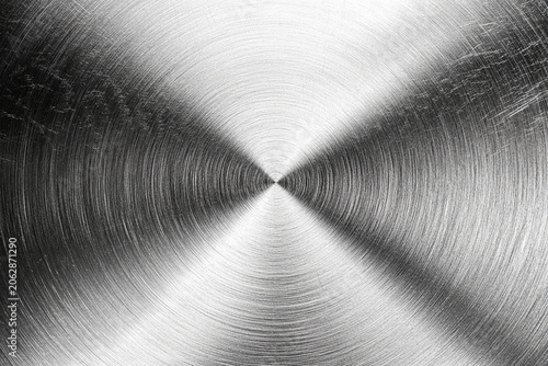 Abstract metal texture: silver metallic surface with concentric circles, symbolizing industry, technology, and modern design for industrial background.