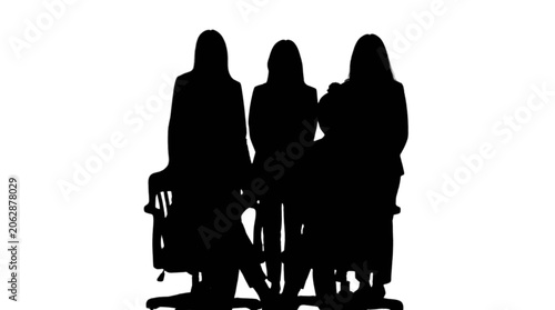 Obraz na plátně Three people sitting together silhouette style isolated on transparent backgroun