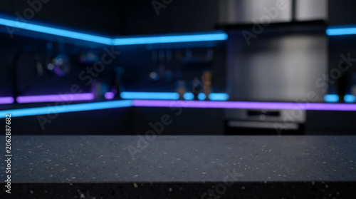 Modern Black Countertop with Blurred Dark Kitchen Neon LED Lighting Background for Tech Product Display Mockup