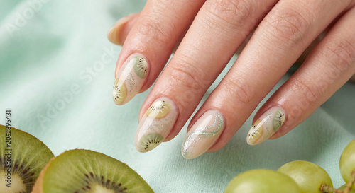 kiwi nail art manicure with hand painted fruit slices and green glitter accent nail
