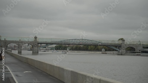 Moscow, September 3, 2024: Andreevsky pedestrian bridge with a glass roof in the center of Moscow. Filmed in motion
