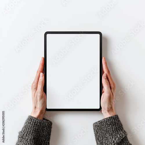 Person holding a blank digital tablet device