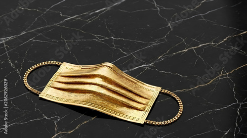 Luxury Golden Face Mask on Black Marble Background.