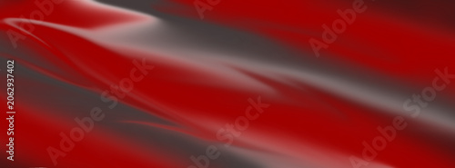 An abstract background featuring smooth, flowing waves of vibrant red and dark grey, accented with subtle lighter streaks. The pattern creates a dynamic and fluid visual effect with a glossy or silky 