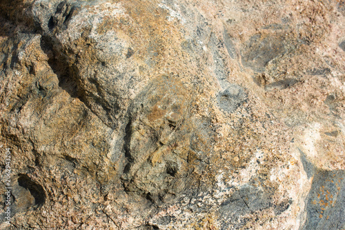 Granite rock. Boulder, rock face. Raw, authentic granite mineral rock, background, texture.