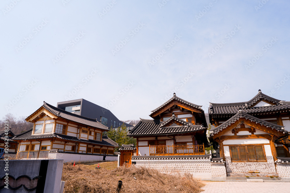 Fototapeta premium Traditional Korean hanok village houses with wooden architecture and tiled roofs