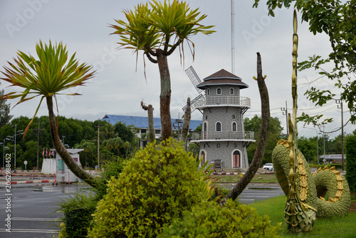 Krabi, Thailand – May 18, 2026: Decorative windmill structure and landscaped roundabout near Klong Jilad Ferry Pier