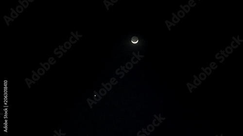 Wide shot of solar energy panels reflecting faint moonlight in pitch black night sky 180fps Captured in Cinematic High Detail Footage