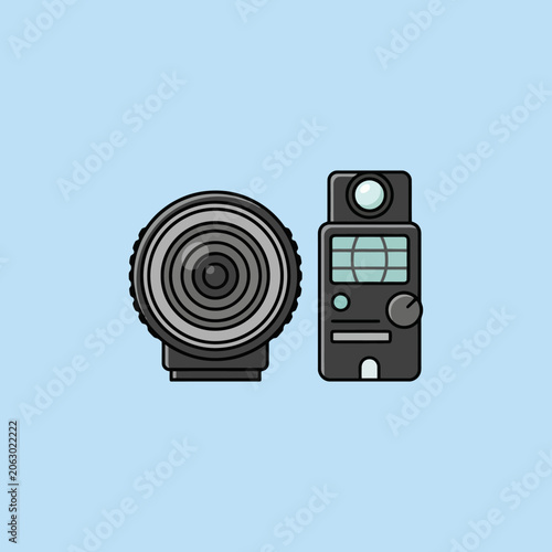 Fotografie A camera lens and a light meter on a blue background