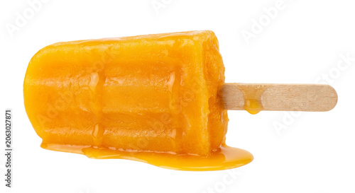 Tableau sur toile Refreshing orange popsicle melting on a wooden stick