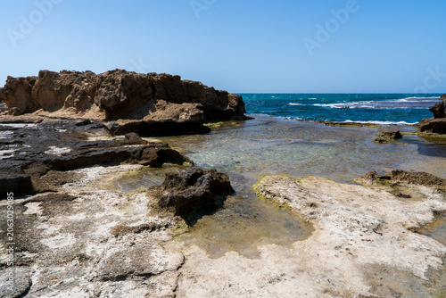  Beautiful Mediterranean shoreline with turquoise waters, remarkable kurkar rock formations, and rich marine biodiversity, offering stunning coastal scenery and a peaceful atmosphere.