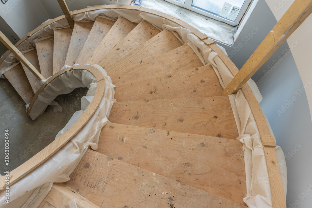 Fototapeta premium Spiral staircase under construction in new house