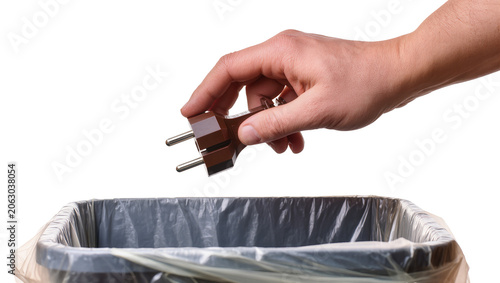 Принти на полотні Hand discarding brown electrical plug into trash bin