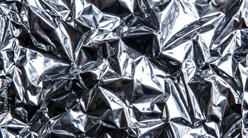 Crumpled silver foil texture background