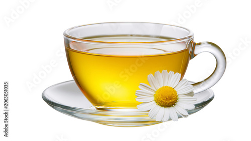 Clear glass cup of herbal tea with chamomile flower on saucer
