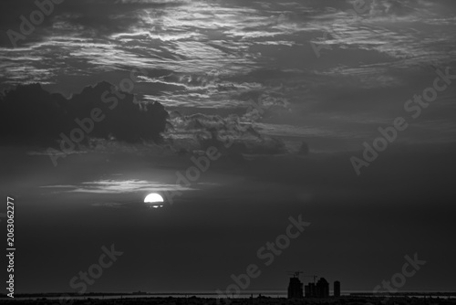 Sunset Over Bahrain with Sun Partially Obscured by a Dust Haze | Black and White