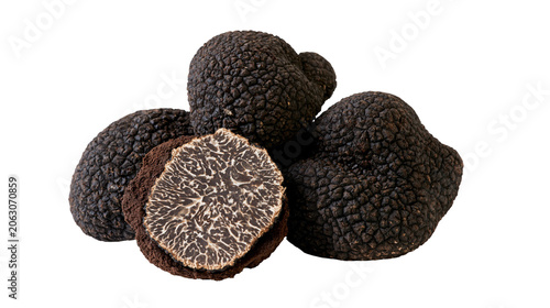 Foto Black truffles, one sliced showing intricate white veining
