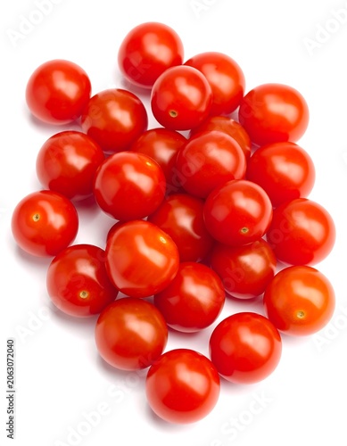 A vibrant cluster of small, round, red fruits with glossy skin