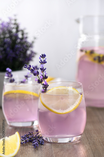 Summer homemade lemonade with lavender syrup, lemon juice and sparkling water with lavender sprigs