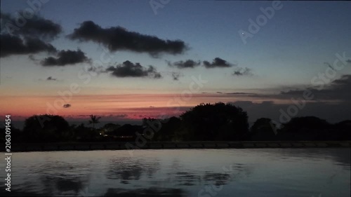 sunset at a rooftop pool in kuta on bali