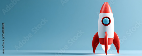 Red Toy Rocket Ship Launching on Blue Background for Startup Concept